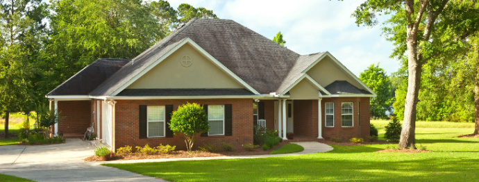 Traditional style country house with landscaping
